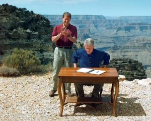 FILE - In this Sept. 18, 1996, file photo, Vice President Al Gore applauds after President Bill Clinton signs a bill designating about 1.7 million acres of land in southern Utah's red-rock cliff as the Grand Staircase-Escalante National Monument, at the Grand Canyon National Park, in Arizona. As Utah waits to see if President Barack Obama will designate a new national monument in the state, the 20th anniversary of the Grand Staircase Escalante-National Monument rekindled memories of an event that ignited simmering western frustrations about federal ownership of public land. (AP Photo/Doug Mills, File)