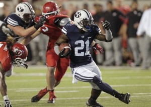 BYU running back Jamaal Williams (21) cuts through the Utah defense during the second quarter of the Saturday, Sept. 15, 2012 game in Salt Lake City. A new pair of games will be played in 2017 and 2018. (AP Photo/Rick Bowmer)