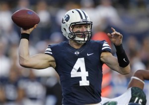 BYU quarterback Taysom Hill throws a pass in last year's game against Hawaii. (Photo by Chris Bunker.)