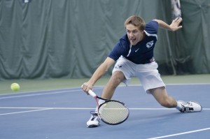 Patrick Kawka hits returns the ball during a match against Weber State. BYU faces UNLV and Denver this weekend. (Photo by Chris Bunker)