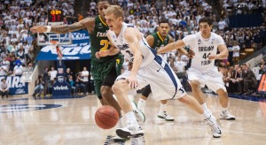 Tyler Haws dribbles by San Francisco defender De'End Parker during last year's game in the Marriott Center. Photo by 