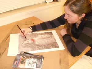 Wyview resident assistant Jillian Ferrell sketches a photo of Carmody Sagers 