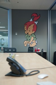 Pebbles from the Flintstones on the wall of one of the conference rooms at Qualtrics. 