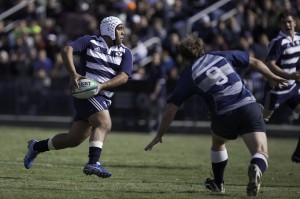 A BYU rugby player prepares to make a pass during a match against Utah State at South Field (Photo by Universe Photographer)