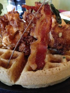 The bacon covered sage-fried chicken and waffles is one of Station 22's signature dishes. (Photo by Ee Chien Chua)
