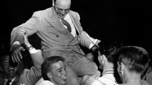Stan Watts celebrates with the 1951 NIT Championship team. (Photo courtesy byucougars.com)