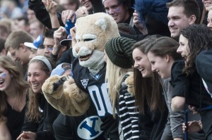 Cosmo poses with fans during the blackout game against Oregon State at LaVell Edwards Stadium in October 2013 (Photo by Universe Photographer)