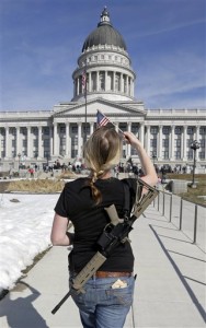 Gun right activist Siri Davidson, carries her AR-15, as she walks during a march for the 2nd Amendment  at the Utah State Capitol, in Salt Lake City (AP Photo)