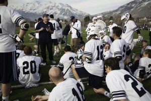 Assistant coach Jordan Harris talks to the team in BYU's game against the Utah St. BYU shut out New Mexico this week in a 26-0 victory. (Photo by   Elliott Miller)