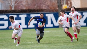 A BYU player runs the ball during its loss against NYAC. BYU faces snow college this week. (Photo by Sarah Hill)