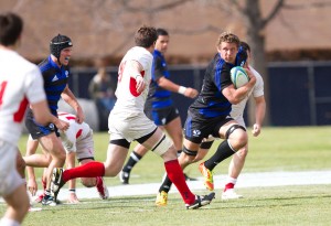 BYU escapes a NYAC defender in its loss to the top semi-pro team in the nation. BYU plays SUU Saturday.