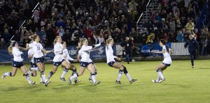 Members of the women's soccer team celebrate their win over Marquette. This picture took 2nd place in the Utah Press Association competition. (Photo by Sarah Hill)