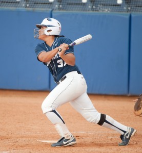 BYU first baseman Katie Manuma connecting with a ball at Gail Miller Field. (Photo by Chris Bunker)