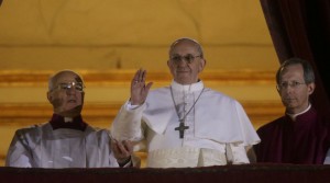 Pope Francis waves to the crowd from the central balcony of St. Peter's Basilica at the Vatican, Wednesday, March 13, 2013. Cardinal Jorge Bergoglio who chose the name of  Francis is the 266th pontiff of the Roman Catholic Church. (AP Photo/Gregorio Borgia)