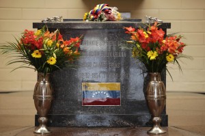 Flowers decorate the tomb of Venezuelas late President Hugo Chavez on display at the Military Museum in Caracas, Venezuela, Wednesday, March 20, 2013. Chavez died on March 5. (AP Photo/Ariana Cubillos)