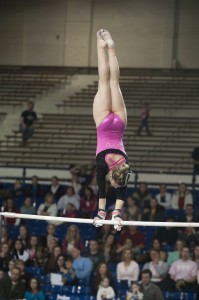 Eliane Kulczyk competes on bars at BYU gymnastics meet.