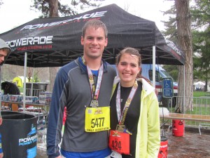 BYU students Ellie Hall and Jackson Deere stand wet and cold but triumphant after running in the Salt Lake City Marathon and half marathon a week after the explosions at the Boston Marathon.