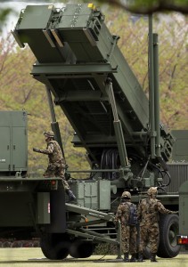 Japan Self Defense Force personnel man PAC3, Patriot Advanced Capability surface to air missiles deployed at the compound of Japan Defense Ministry amid a tense situation over North Korea's possible possession of nuclear warheads. (AP Photo/Junji Kurokawa)