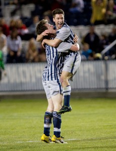 Jonathan Junca and Tanner Whitworth  celebrate in a game against University of Utah. (Photo by Sarah Hill)