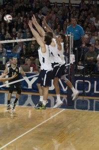 Josue Rivera, Devin Young and Ben Patch go up for a block in a match earlier this season. (Photo by Whitnie Soelberg)