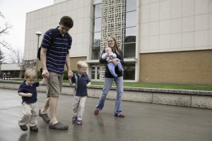 Jonah Barnes, a BYU student, spends time with his family on campus. (photo by Elliott Miller)