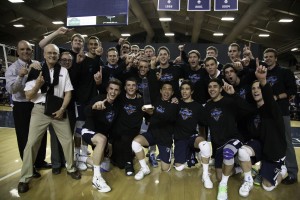 The BYU volleyball team holds up its trophy after winning the MPSF championship. (Photo by Elliott Miller)