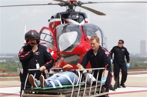 Life Flight personnel rush a victim wounded in a stabbing attack. (AP Photo)
