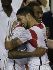 Louisville guard Kevin Ware, left, and Louisville guard Peyton Siva (3) embrace after Louisville defeated Michigan for the NCAA Division I Championship. (AP Photo)