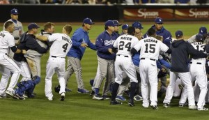 Padres Outfielder Carlos Quinton charges Dodgers Pitcher Zack Greinke resulting in a benches clearing brawl (AP Photo)