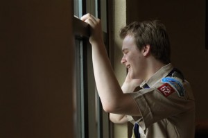 Boy Scout Pascal Tessier talks on the phone with national media reporters after hearing the announcement by Boy Scouts of America passing a resolution allowing scouts that are openly gay into their ranks, Thursday, May 23, 2013, in Grapevine, Texas. Tessier was in the command post for the group, Scouts for Equality at Great Wolf Lodge. Tessier is a Life Scout who was unable to finish his Eagle Scout unless the resolution passed. (AP Photo by Brad Loper)