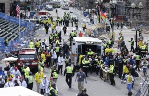 Medical workers aid injured people at the finish line of the 2013 Boston Marathon following a bomb explosion in Boston, Monday, April 15, 2013.  (AP Photo)