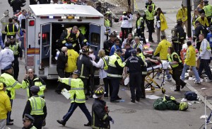 Medical workers aid injured people after two bombs exploded near the finish line of the Boston Marathon in Boston. While giving is the reliable flip side to tragic events, charity watchdog groups recommend seeking out well-established charities, or credibly backed efforts like The One Fund, established by Massachusetts Gov. Deval Patrick and Boston Mayor Thomas Menino. (AP Photo/Charles Krupa)