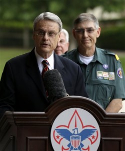 In this Thursday, May 23, 2013 file photo, Boy Scouts of America Chief Scout Executive Wayne Brock, addresses questions during a news conference accompanied by BSA National President Wayne Perry, background right, in Grapevine, Texas. Brock has pleaded for the Scouting community to reunite after the divisive debate that led to Thursday's vote by the BSA's National Council. The proposal to lift the ban on openly gay youth - while keeping the ban on gay adults - was supported by about 60 percent of the councils 1,400 voting members. (AP Photo by Tony Gutierrez)