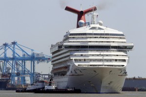The Carnival Triumph departs from the Alabama Cruise Terminal in Mobile, Ala., Wednesday, May 8, 2013. The ship had docked for repairs in Mobile for about three months after it limped into port  because of an engine-room fire that disabled the vessel.  (Associated Press)  