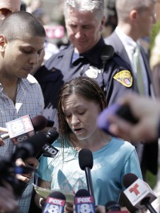 Beth Serrano, sister of Amanda Berry, reads a statement to the media after the arrival of Berry Wednesday, May 8, 2013,at her home in Cleveland. Berry is one of three women  missing for about a decade and apparently held captive in the house in Cleveland police said. (AP Photo/Tony Dejak)