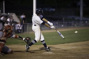 Brennon Anderson makes a hit in Tuesday's home game against the University of Utah. (Photo by Elliott Miller)