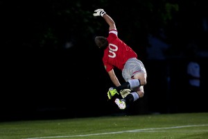 Goalie Brian Hale makes a diving save during Friday night's game at South Field.