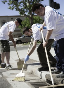 Merrill Steel, James Raddatz, and Kin Nelson help clean up Center Street in Provo as part of Nu Skin's Force for Good Day June 6. Photo by Elliott Miller