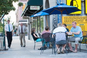 A group of people eat at Rocco's Tacos on Center Street in Provo on a summer evening. Photo by Chris Bunker