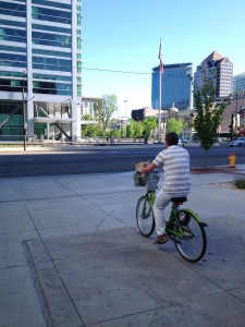 Local GREENbike user brings his groceries home on his bike.
