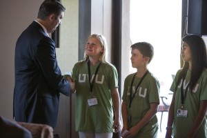UVU President Matthew S. Holland, greets UVU PREP students (from left)  Eliza Ballantyne, Ben Zobrist and Jaquelyn Lazos at the Utah Valley University The Social Summit at Riverside County Club in Provo, Utah Monday July, 15, 2013. (Photo byAugust Miller, UVU Marketing)
