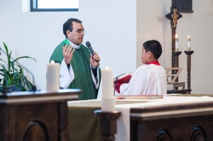 Father Fernando Velasco and an alter boy celebrate mass at St. Francis of Assisi in Orem on July 28.