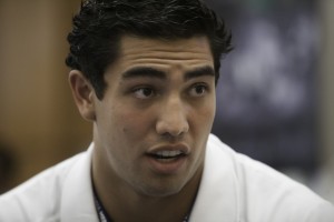 Bronson Kaufusi talks with reporters about his upcoming season at BYU Football Media Day 2013. Many of his teammates and coaches say Kaufusi can fill the big shoes Ziggy Ansah left behind. Photo by Elliott Miller