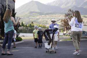 Kids skateboard limbo before the award ceremony at the Helmet2Board Instagram competition. Photo by Elliott Miller