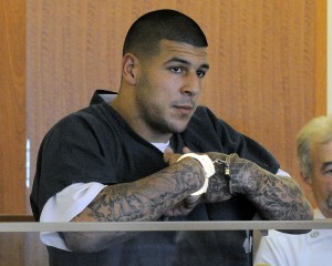 Former New England Patriots football tight end Aaron Hernandez stands during a bail hearing in Fall River Superior Court in Fall River, Mass. (AP Photo/Boston Herald, Ted Fitzgerald, Pool)