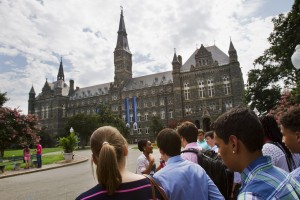 FILE - In this July 10, 2013 file photo, prospective students tour Georgetown University's campus in Washington. The Senate could vote as early as Thursday on a bipartisan compromise that heads off a costly increase for returning students.  (AP Photo/Jacquelyn Martin)