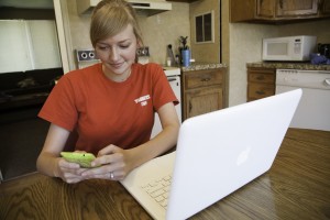 Caitlin Mecham interacts with friends via texting and online messaging.