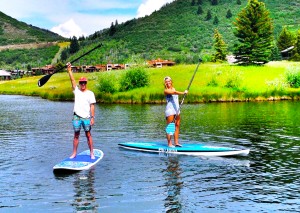Alex Bertha and Lauren Ramsey enjoy a day of paddleboarding on a pond in Park City. Photo courtesy Alex Bertha