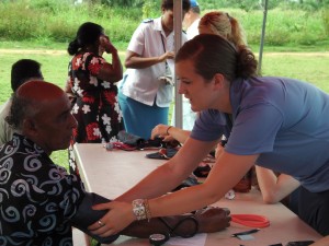 Jannette Perry takes blood pressures during one of the free clinics. (Photo courtesy Mallory Lutes)