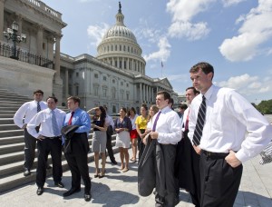 College students wait by the steps of the House of Representatives for Speaker of the House John Boehner, R-Ohio, and GOP leaders to arrive for a news conference on federal student loan rates which doubled on July 1, at the Capitol in Washington, Monday, July 8, 2013. (AP Photo/J. Scott Applewhite)